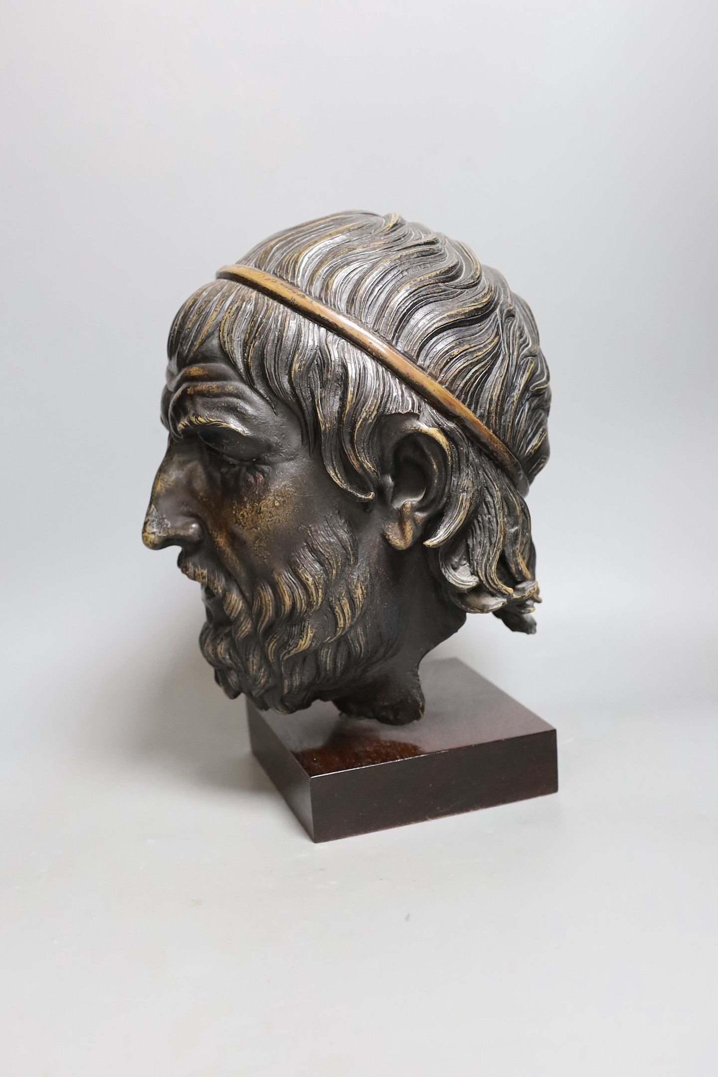 A bronzed composition figure of a classical head. 32cm tall